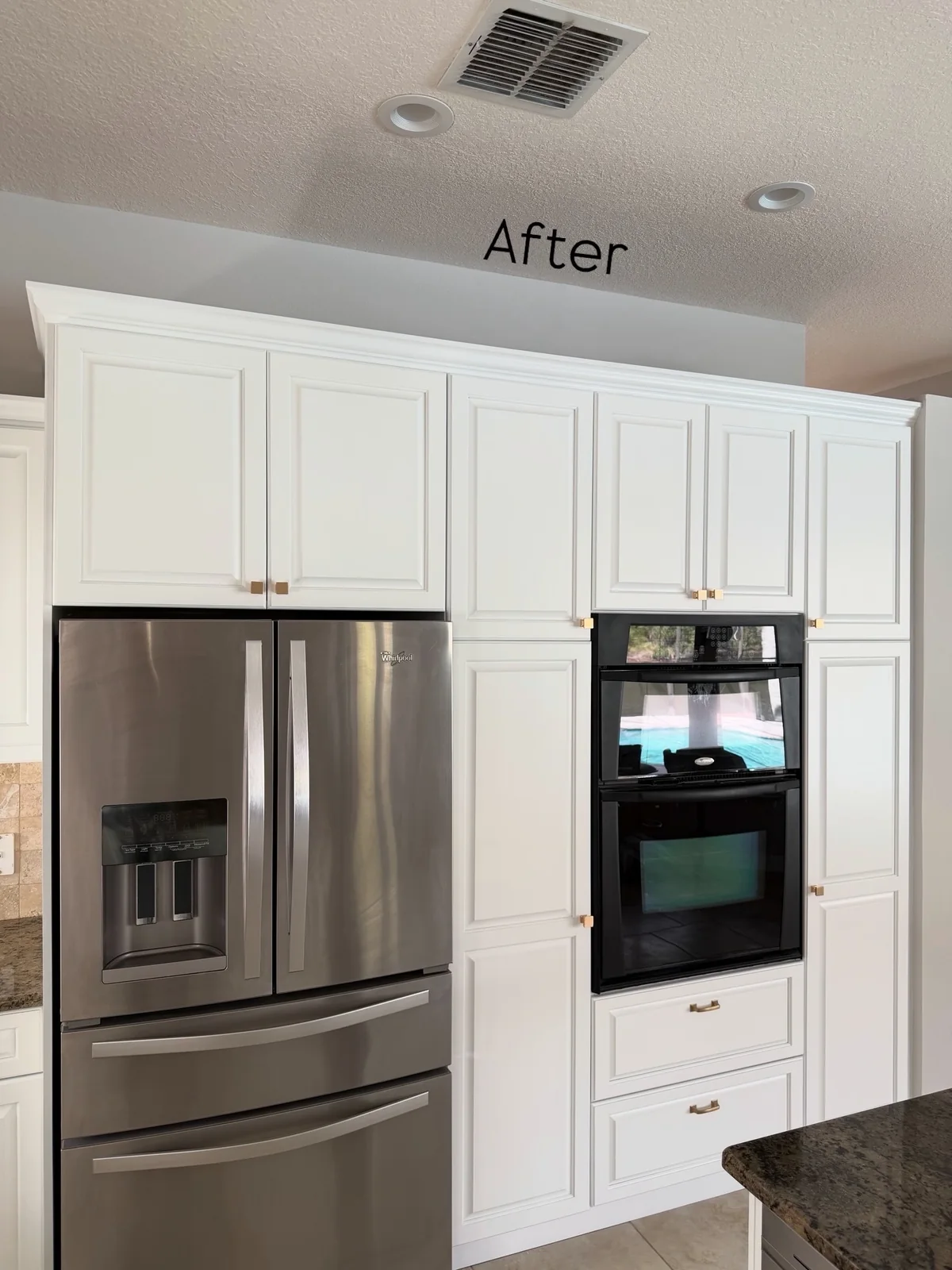 Kitchen with classic-white refinished cabinets